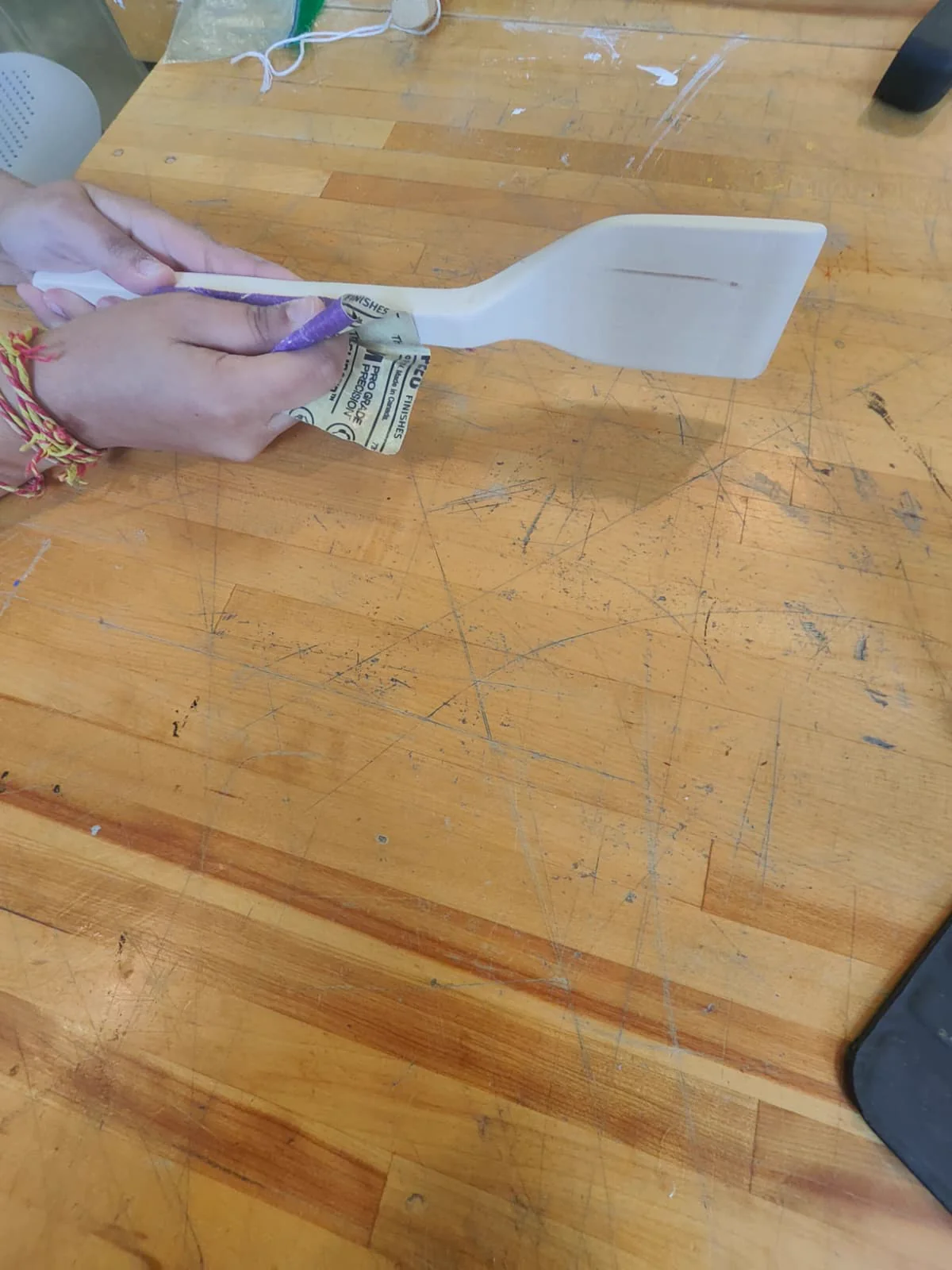 Me roughly sanding out a very slight bump I had found in the handle.